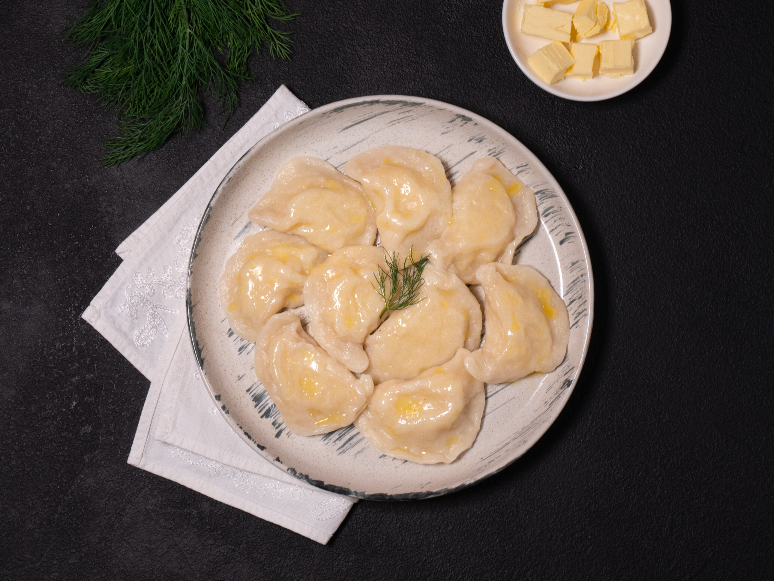 Potato varenyky (dumplings) with butter