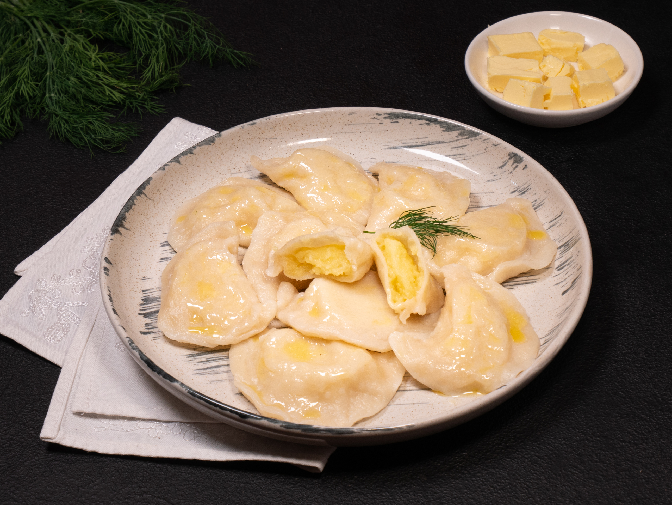 Potato varenyky (dumplings) with butter