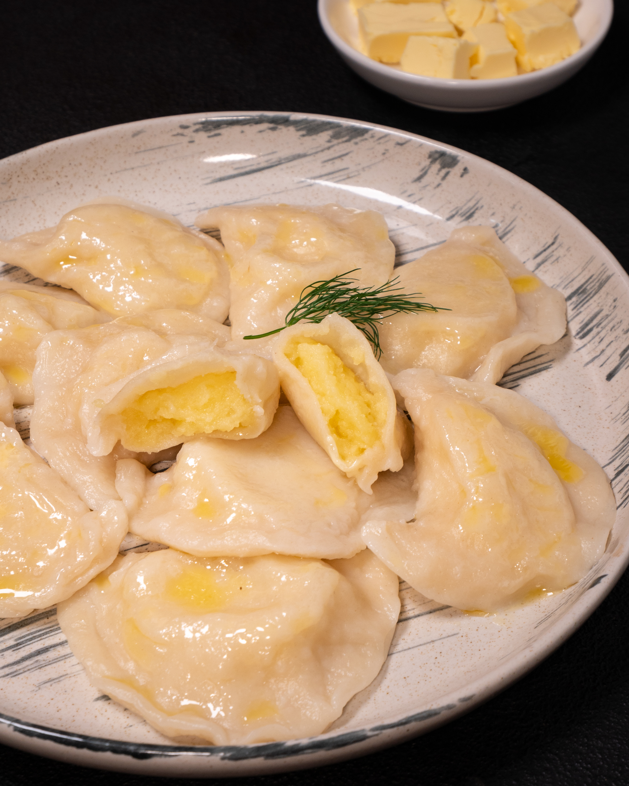 Potato varenyky (dumplings) with butter