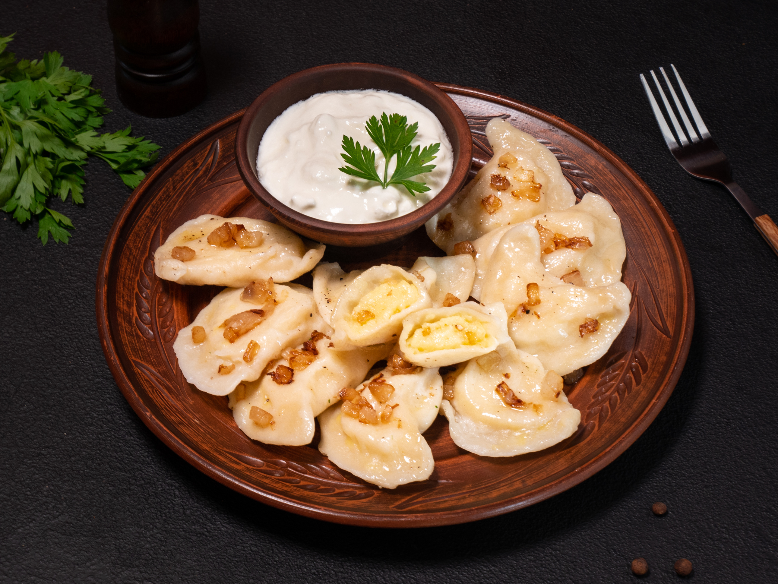 Potato varenyky (dumplings) with bacon crisps