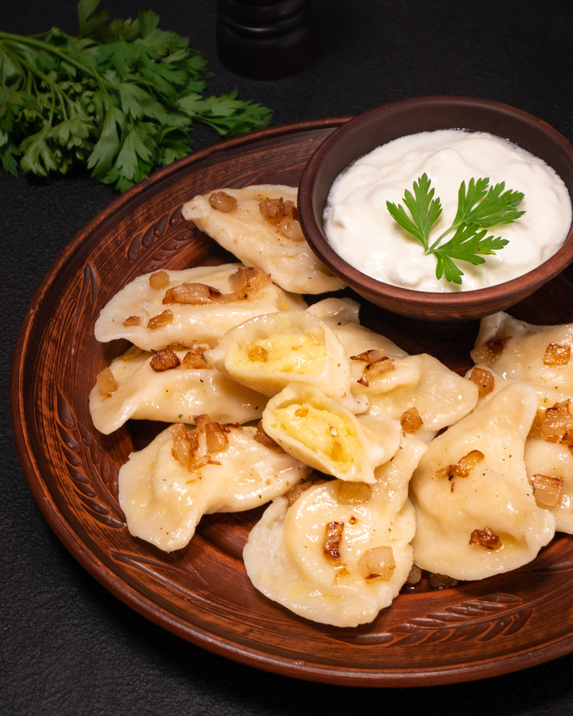 Potato varenyky (dumplings) with bacon crisps